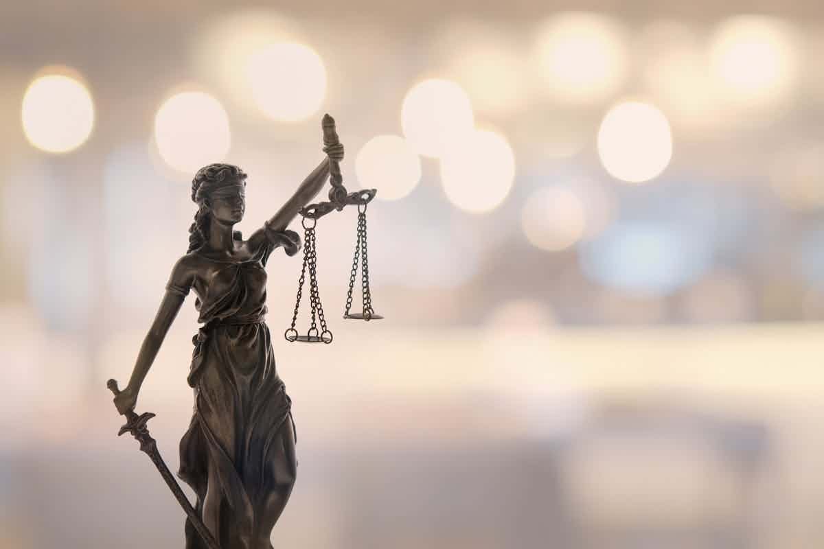 Image of lady justice holding up scales