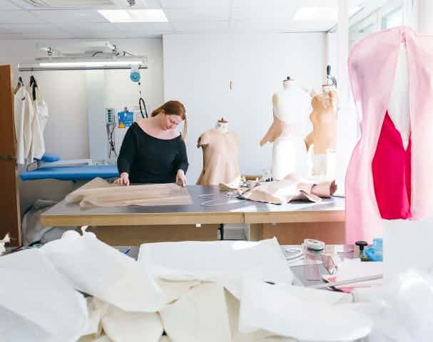 Woman working in a fashion design room