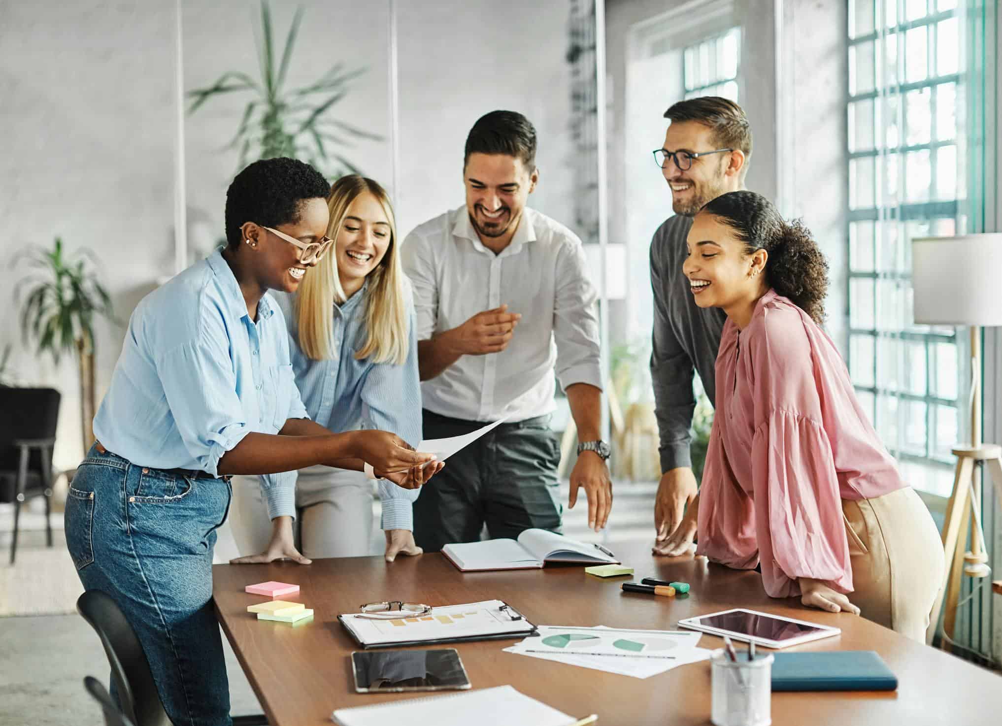 Group of young people working together at an office space