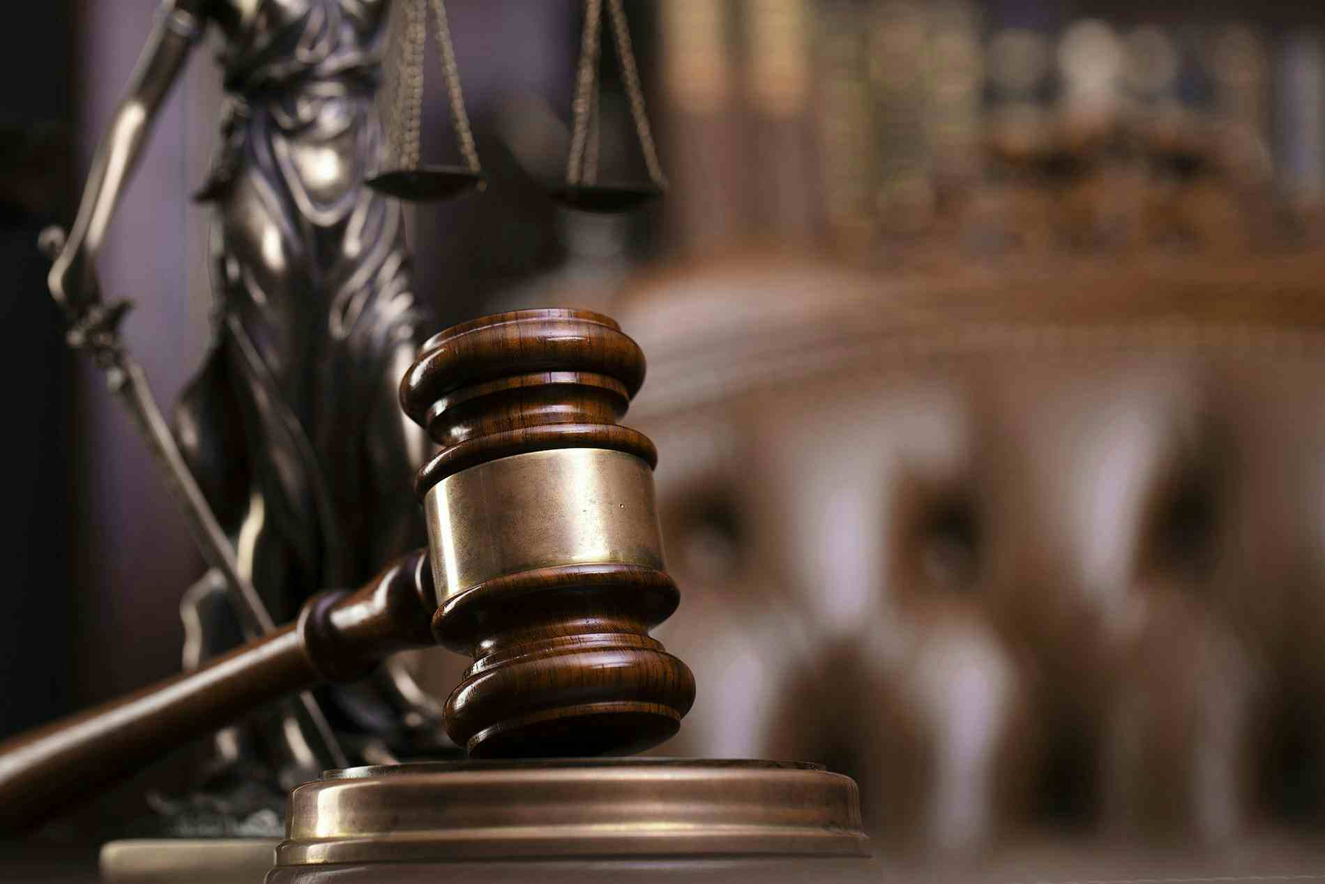 Gavel and scales of justice in courtroom