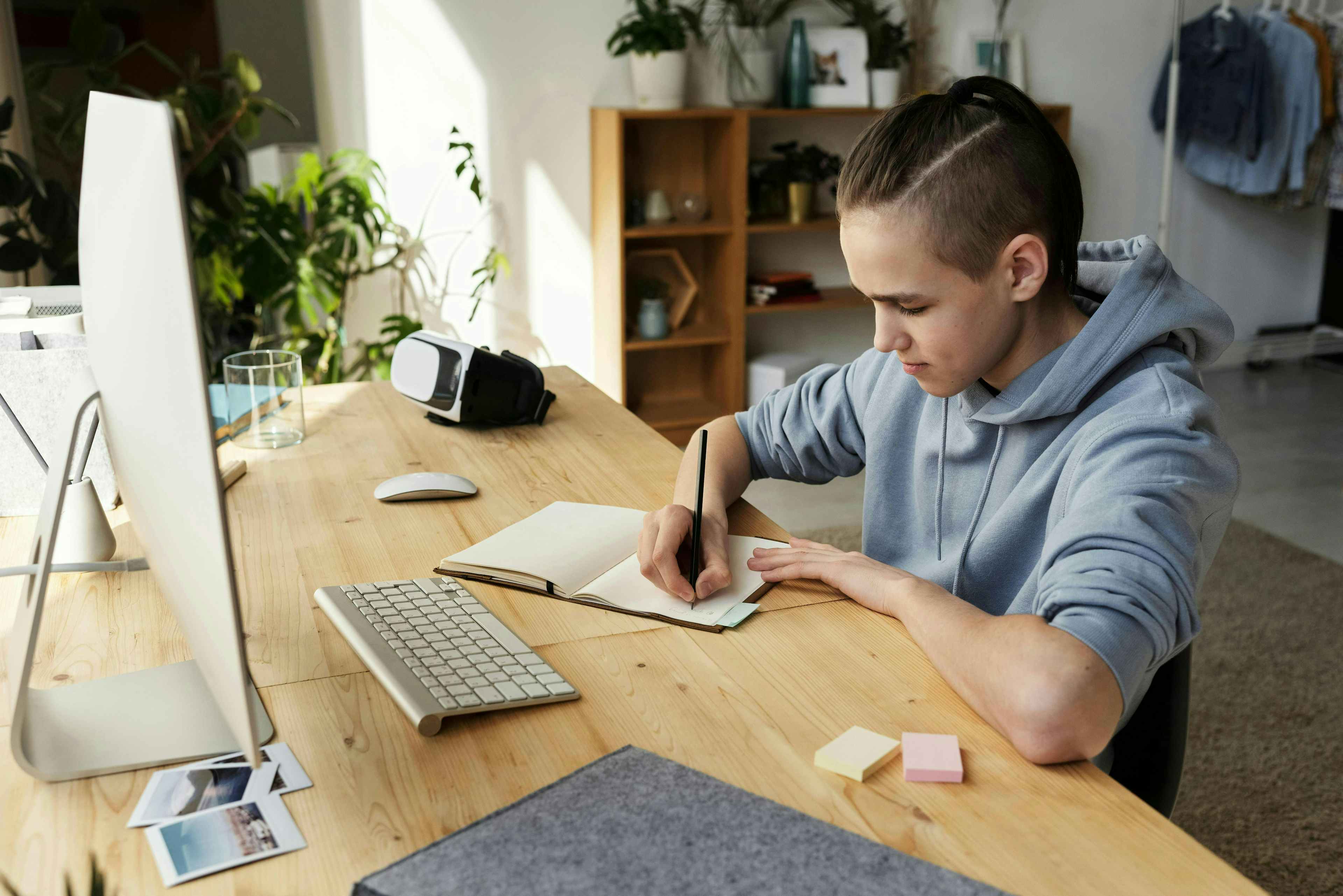 Teen working at his desk 